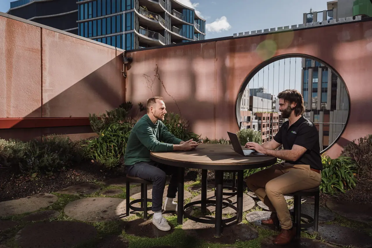 Launch Housing - two people talking.